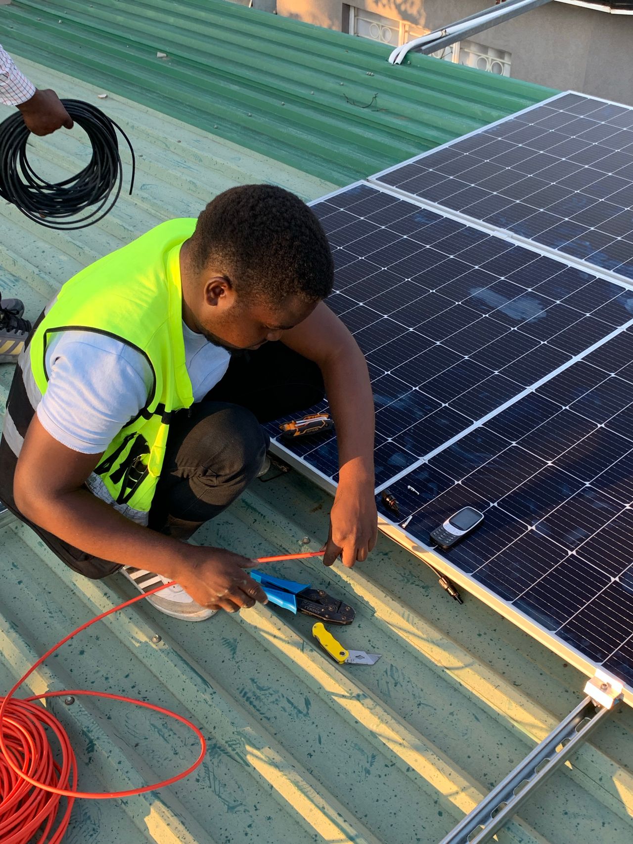 solar technicaian. abuja solar and energy company. abuja residential home with rooftop solar installation and battery system